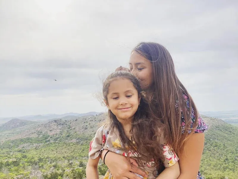 Ariel with her daughter outdoors